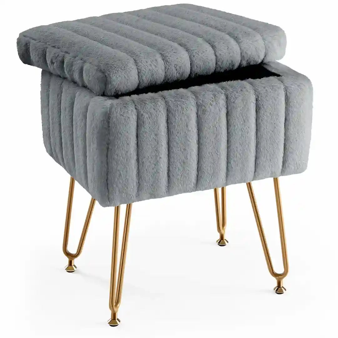 Close-up of soft faux fur upholstery and gold metal legs.home decor ideas.