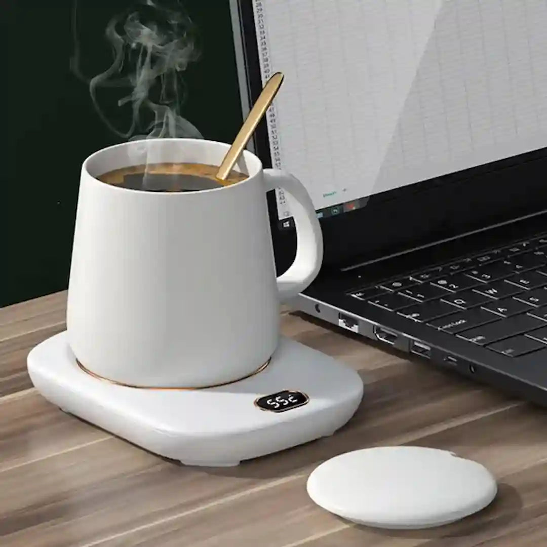 Simplix coffee warmer on home office desk beside laptop and notebook