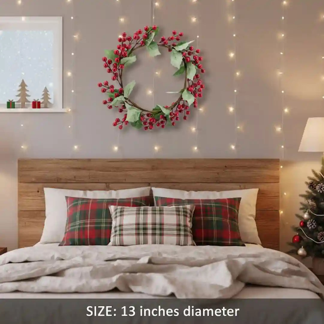 Artificial Christmas door wreath with berries and pine cones